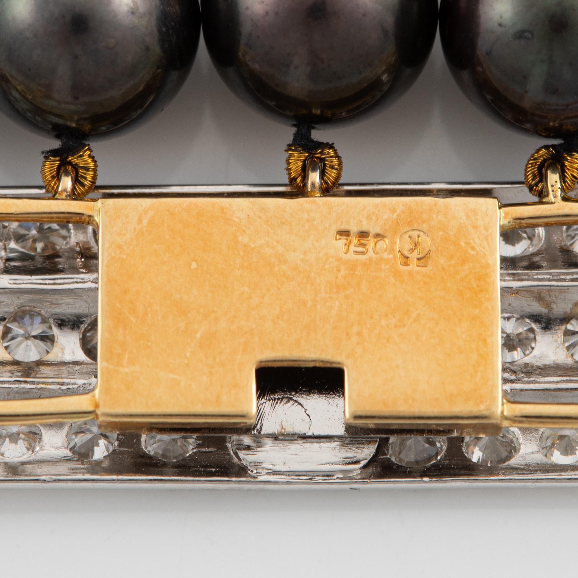 Necklace, five-row with cultured black pearls, 18K gold and white gold with brilliant-cut diamonds.