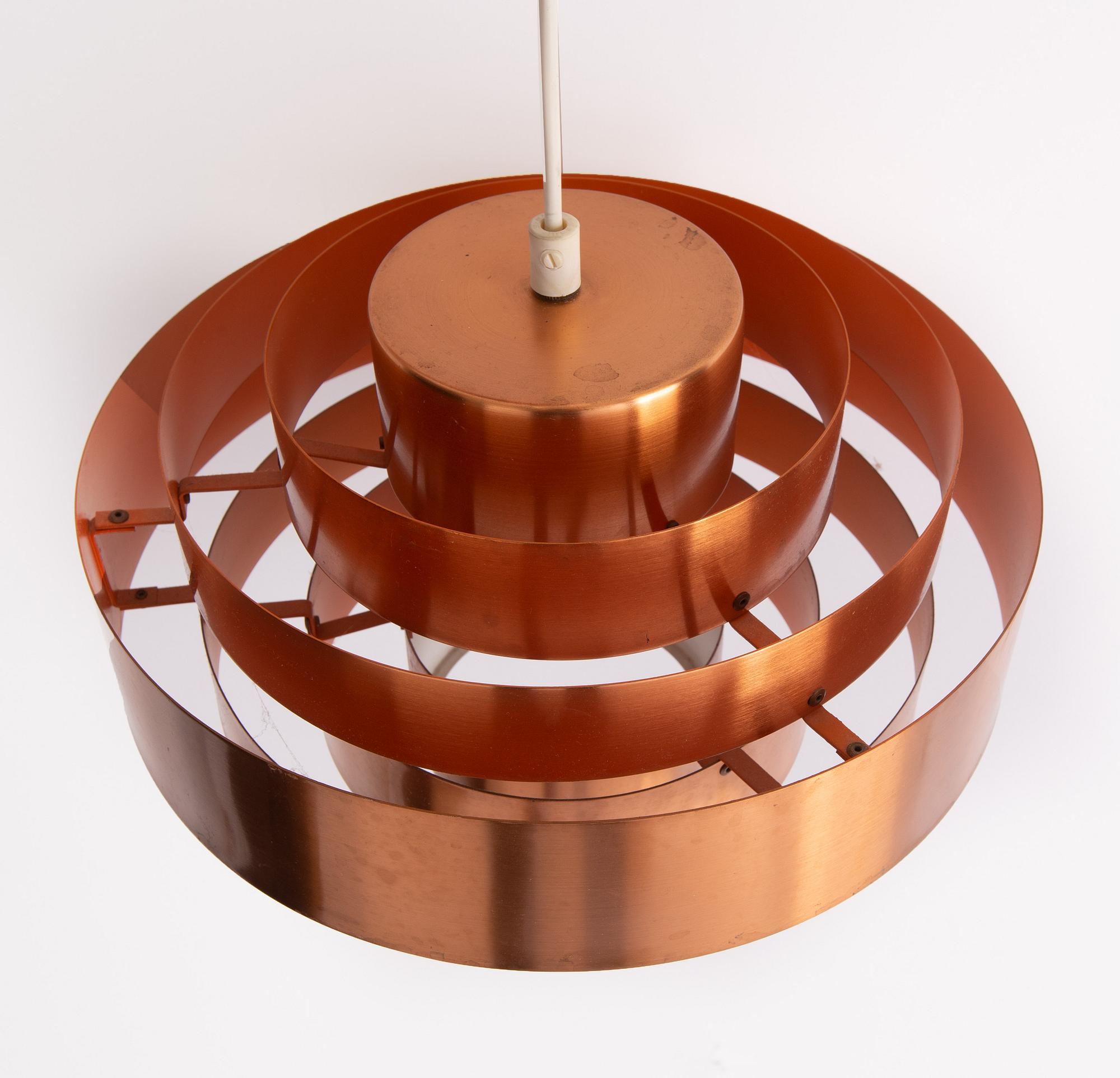 A copper ceiling lamp, by Fog & Mørup, Denmark, and a copper mirror, Markaryd.