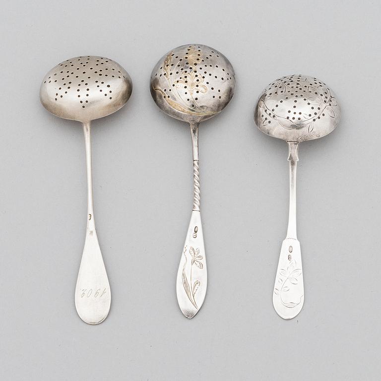 Three Russian silver tea strainer/ sprinkle spoons, late 19th to early 20th century.