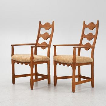 Henning Kjærnulf, a pair of oak 'Razorblade' armchairs with new sheepskin upholstery, from EGK, Demark, 1960s.
