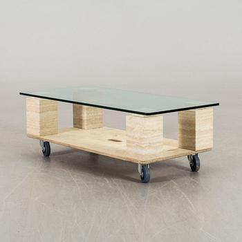 A GLASS TOP COFFEE TABLE.