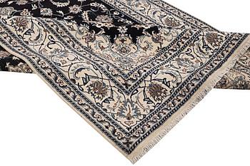 A carpet, Nain, part silk, ca 307 x 198 cm.