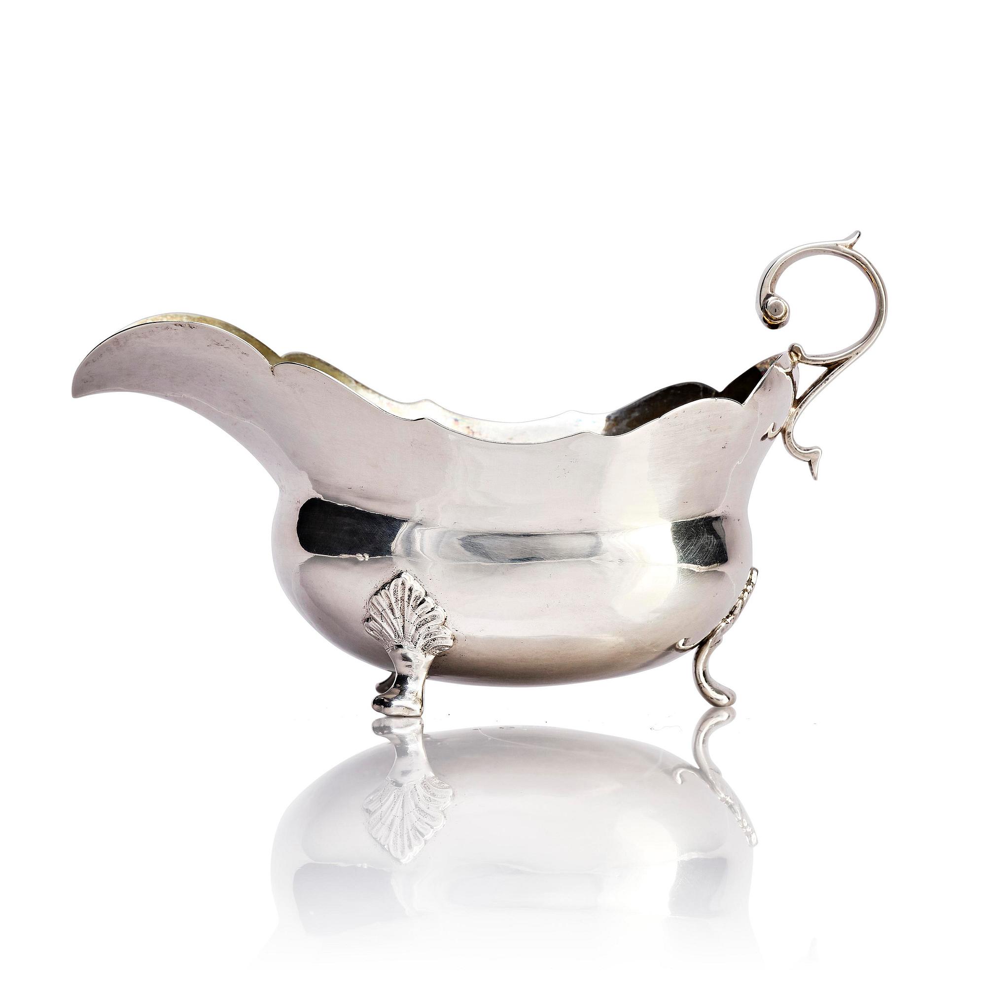 A Swedish mid- 18th century parcel-gilt silver cream-jug, mark of Johannes Weste, Stockholm 1755.
