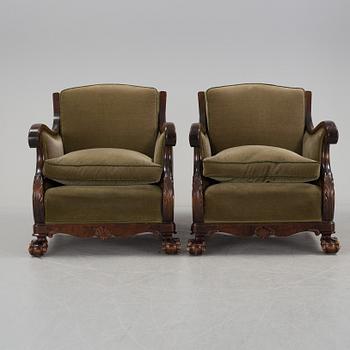 A pair of armchairs and a table, mid 20th century.