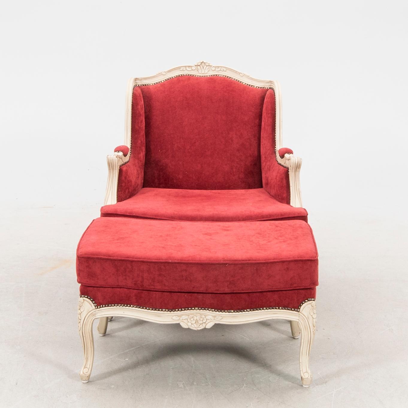 A Louis XV style armchair with stool second part of the 20th century.