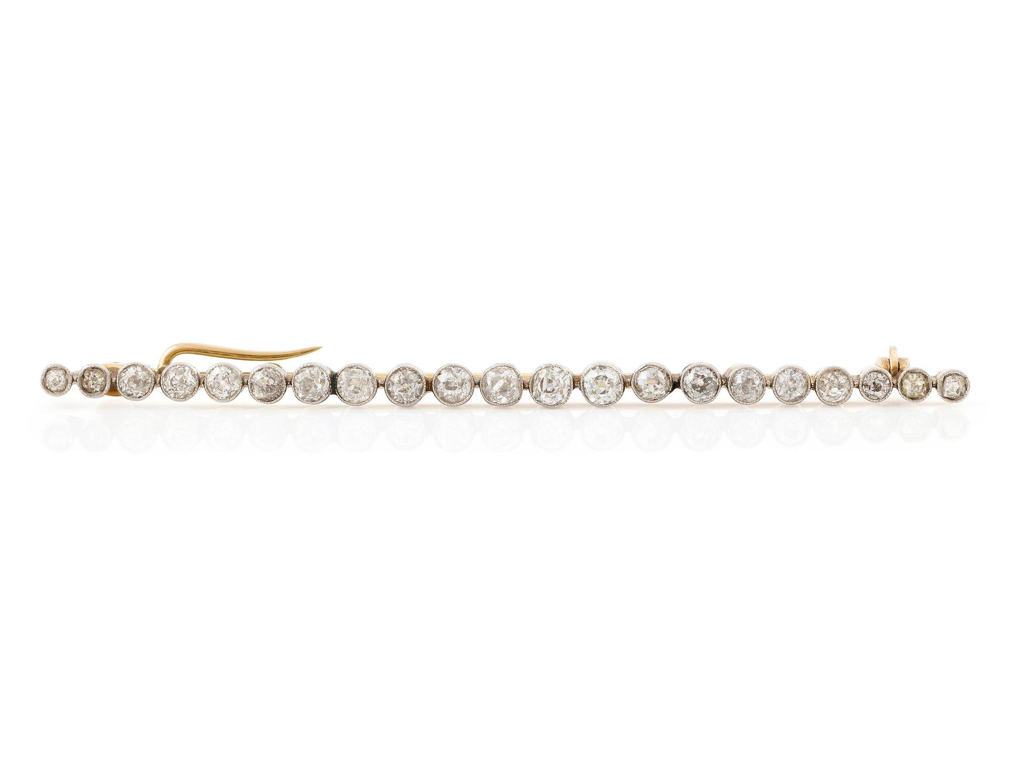 A brooch/pendant, pin, gold and platinum set with old-cut diamonds.