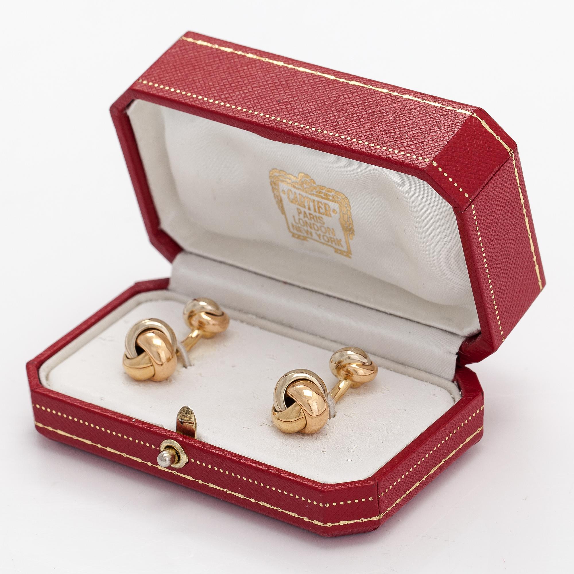 Cartier, A pair of 18K gold "Trinity" cufflinks. Marked Cartier M03073.