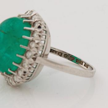 A emerald and brilliant cut diamond ring.