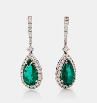A pair of earrings with emeralds, total carat weight 4.35 cts, and diamonds, total carat weight 1.11 ct.