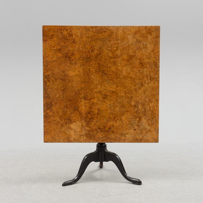 A 19th century folding table with root veneer.