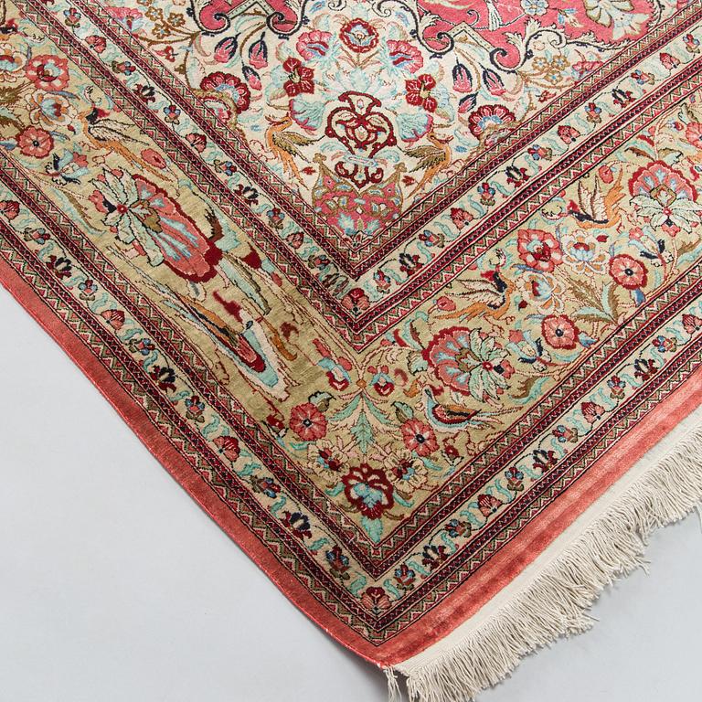 A silk Qum rug, central Persia, approx. 232 x 137 cm.