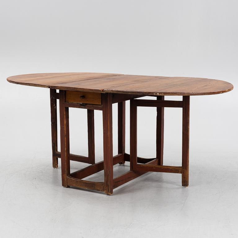 A pine gate-leg table, 19th Century.