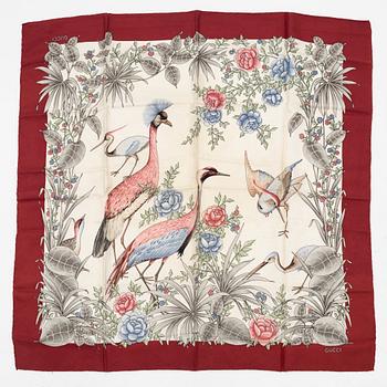 Gucci, a silk scarf.