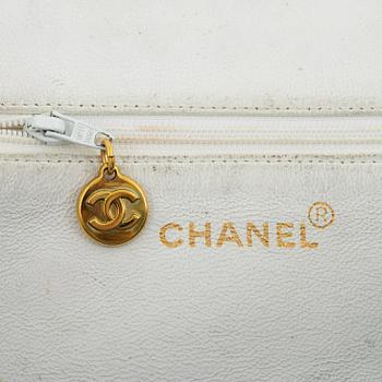 Chanel, a white caviar vintage bag.