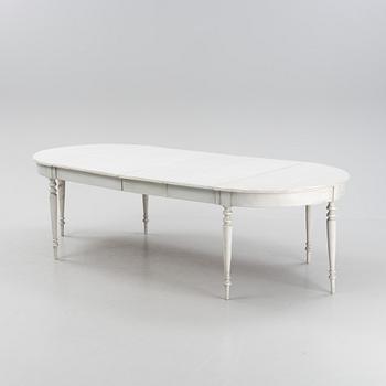 A painted dining table, 20th Century with older parts.