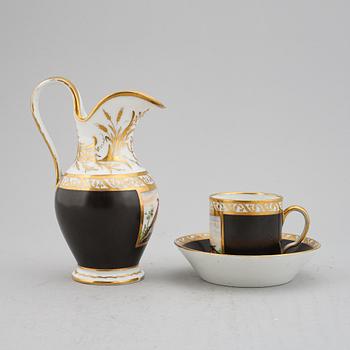 A porcelain jug and a cup with saucer, empire style, circa 1900.