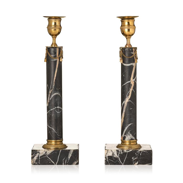 A pair of Gustavian black marble candlesticks.