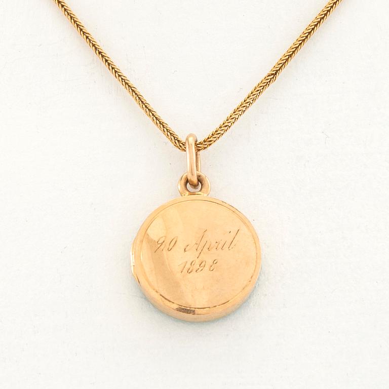 Halsband 18K guld med berlock.