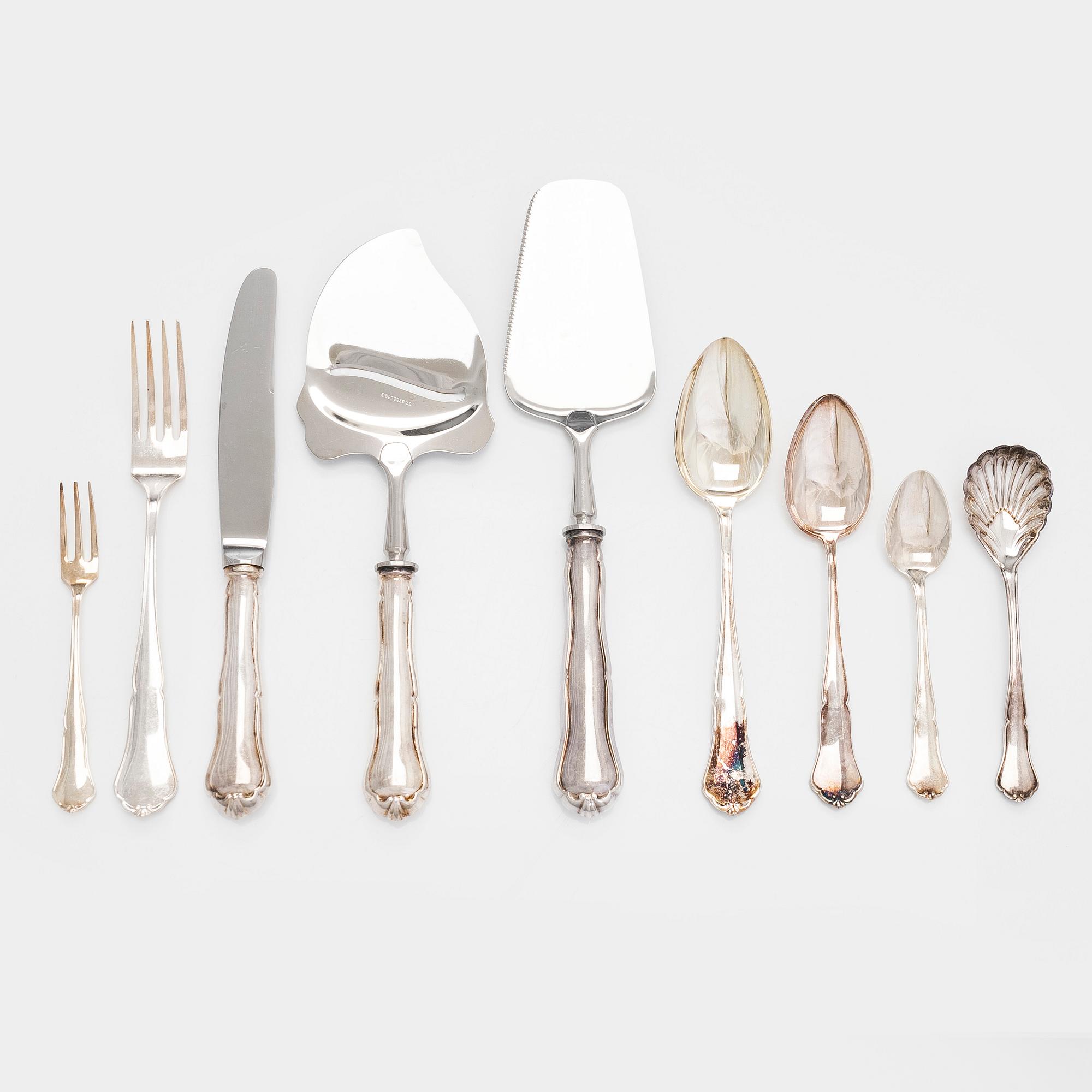 A 59-piece silver 'Chippendale' cutlery set, 20th century. Various Finnish manufacturers.