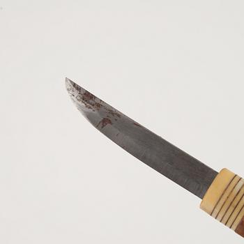 A reindeer horn knife, signed.