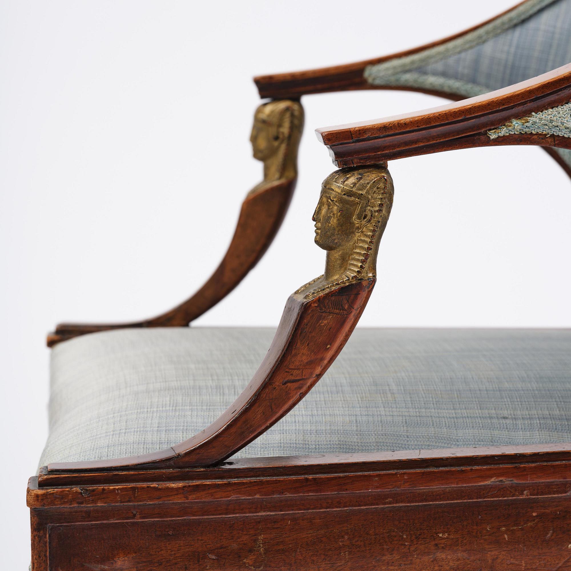 A pair of late Gustavian mahogny armchairs.