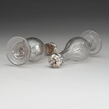 A pair of Swedish 18th century glas-bottles and silver-covers, marks of Arvid Floberg, Stockholm 1766.
