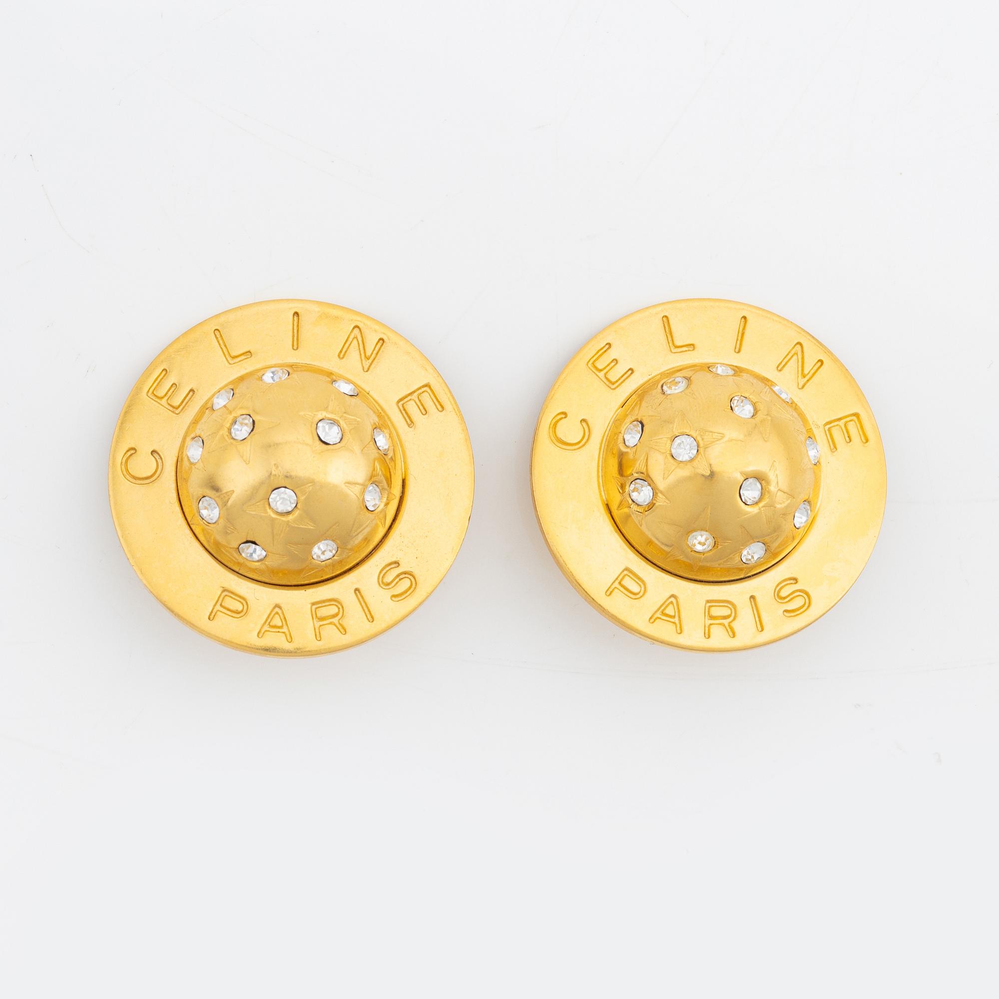 Céline, a pair of gold tone and rhinestone clip-on earrings.