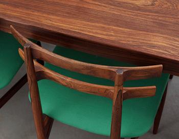 A Poul Hundevad palisander dining table with 8 chairs by Hundevad & Co, Denmark.