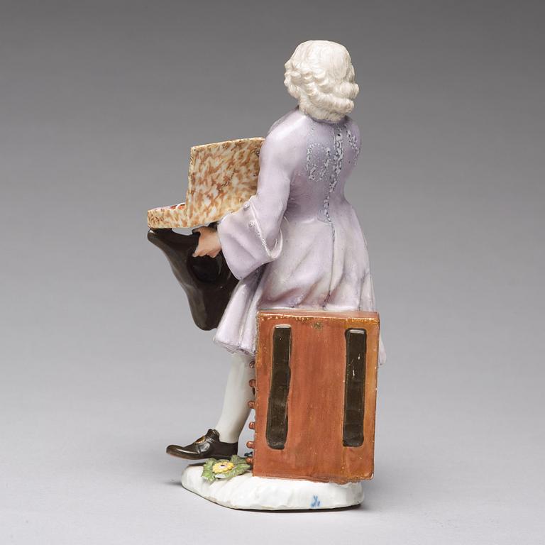 A Meissen porcelain figure of a trinket salesman from the series of Parisian street-traders, circa 1745.