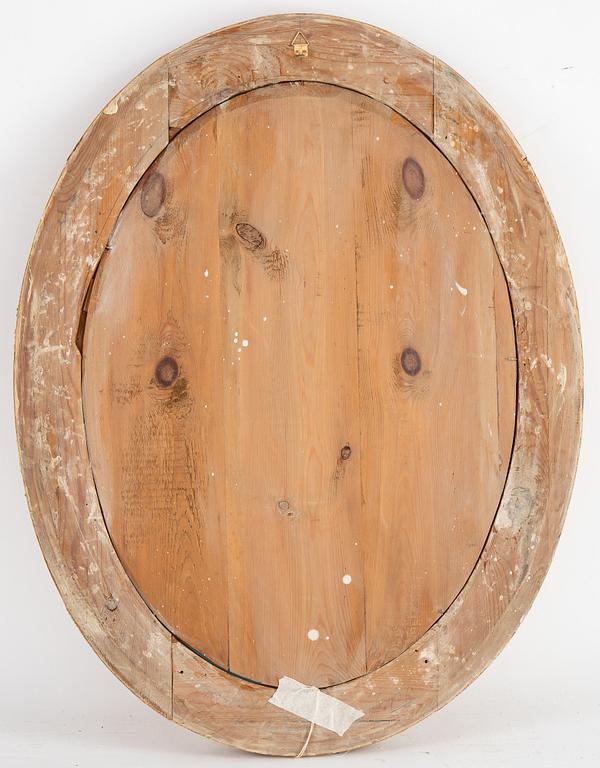 An oval mirror from around the year 1900.