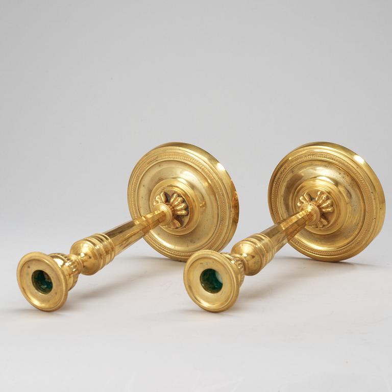 A pair of French Empire early 19th Century candlesticks.