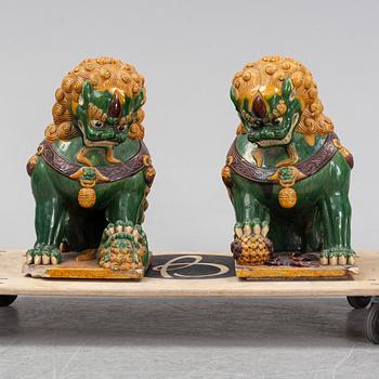 A pair of sancai-glazed chinese buddhist lions or guardian lions, early 20th century.