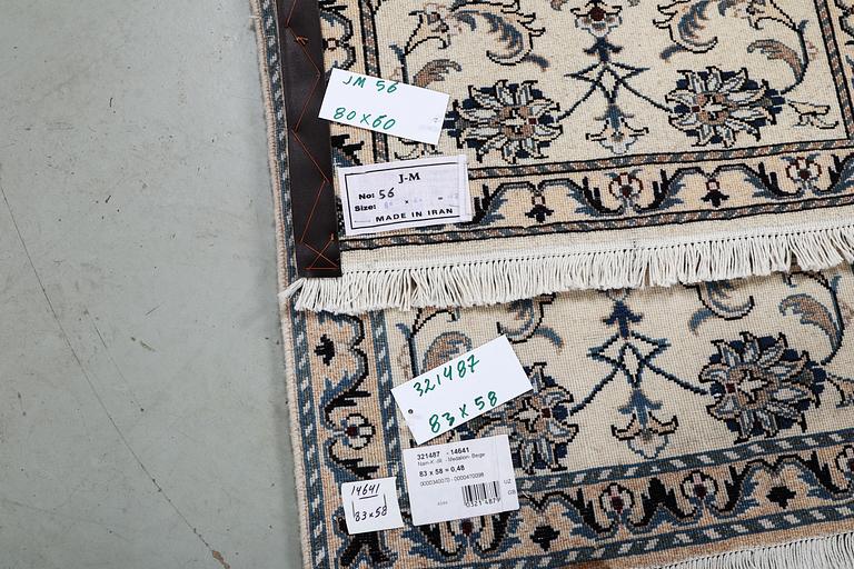 A pair of rugs, Nain, part silk, ca 83 x 58 cm & ca 80 x 60 cm.