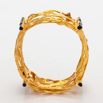 Björn Weckström, an 18K gold and tourmaline 'Sacrificial fire' bracelet. Lapponia 1971.