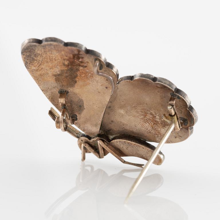 Brooch/pendant and earrings, in the form of butterflies, silver with turquoises and pearls.