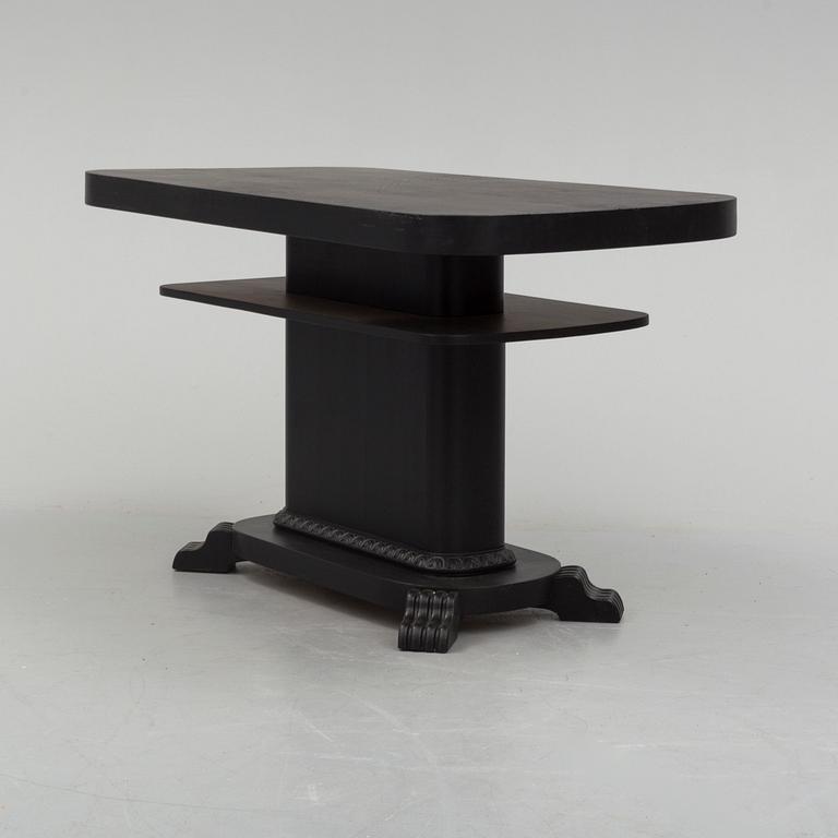 a coffee table from the first half of the 20th century.