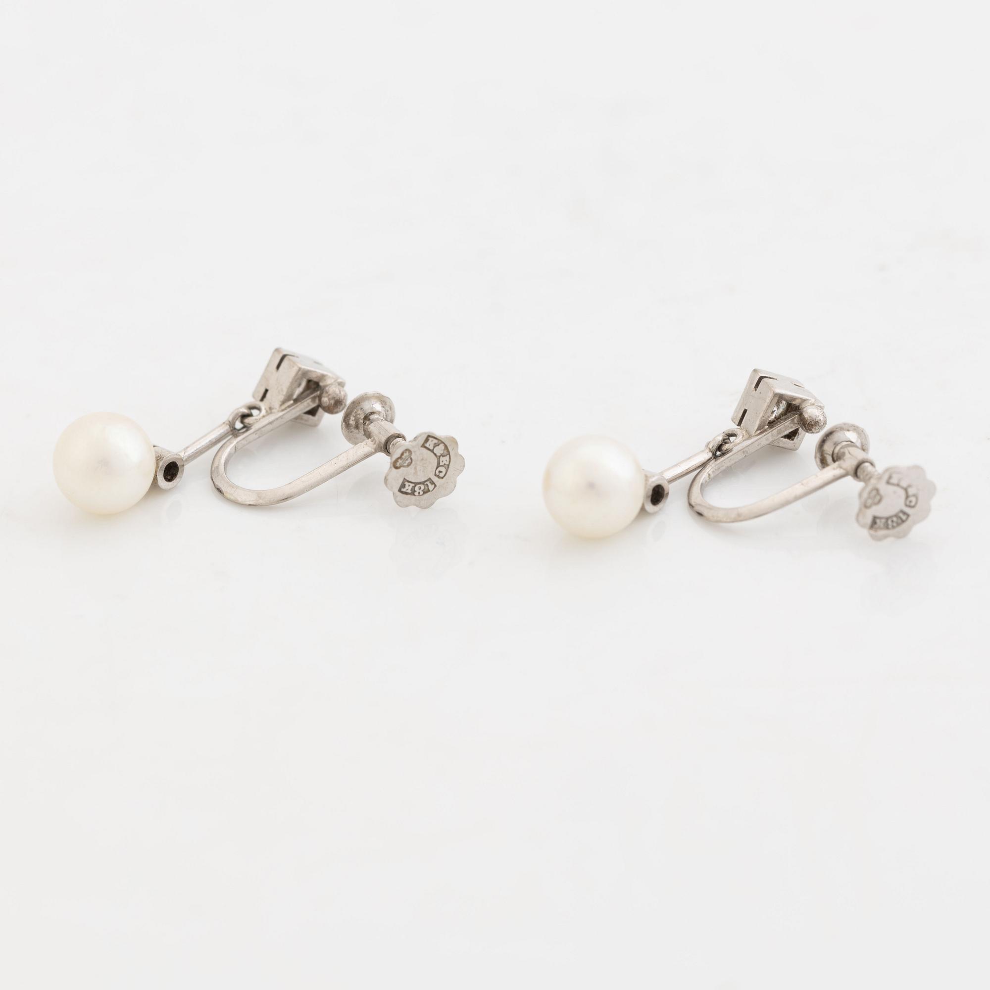 Cultured pearl and diamond earrings.