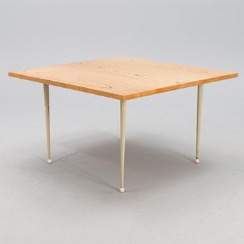 A coffee table marked Tapio Wirkkala, Asko, Made in Finland.