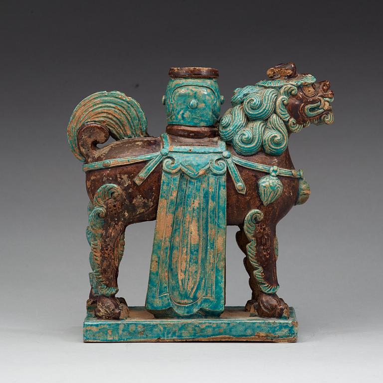 A turkoise and aubergine glazed figure of a Mythical beast, late Ming dynasty (1368-1644).