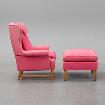 An 'Oxford' model no 3543 easy chair with stool by Ragnar Helsén for Firma Svenskt Tenn.