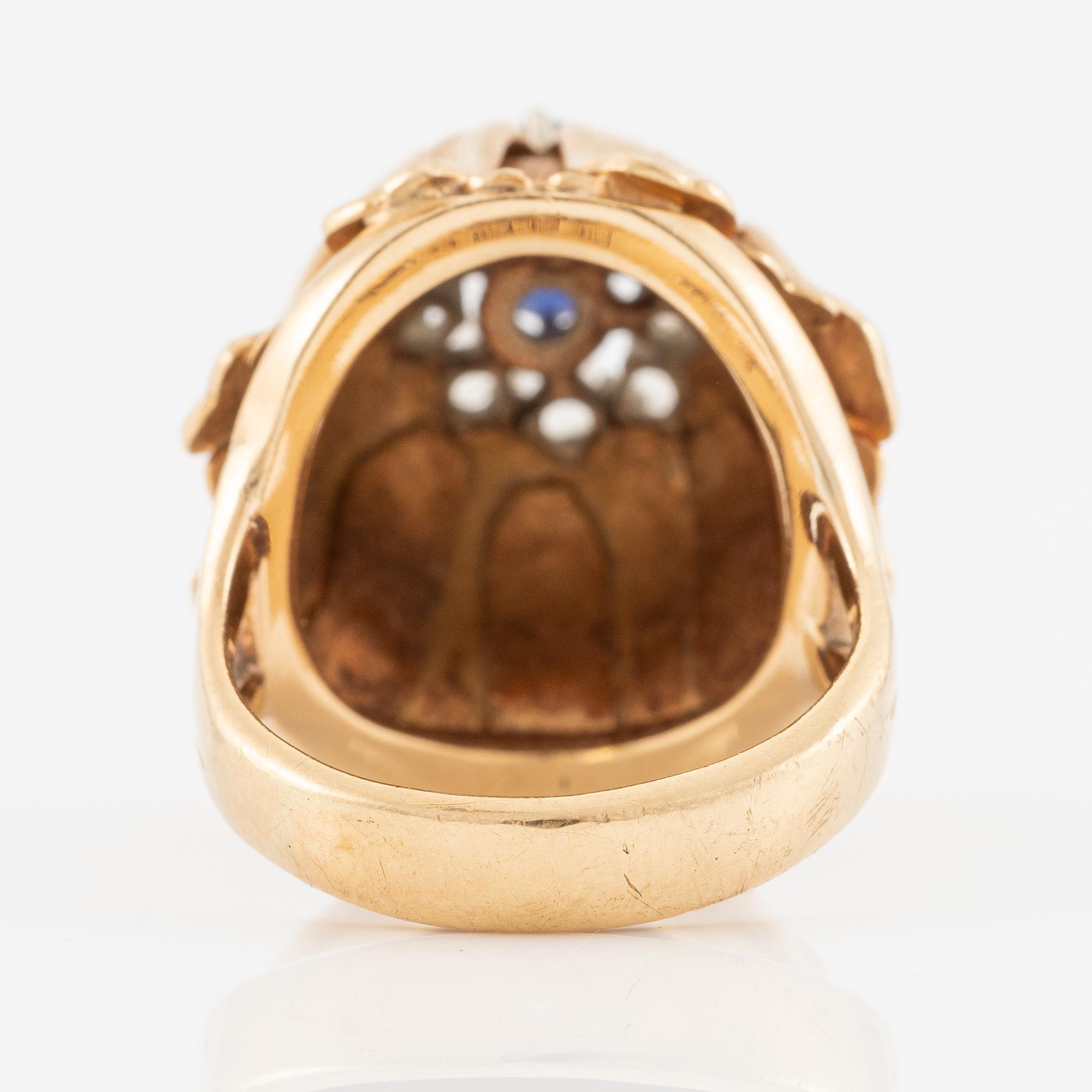 Ring, Hans Scherlund, 18K gold with white and blue stones.