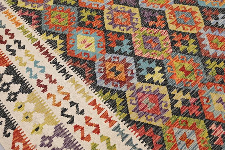 A Kilim carpet, approx. 344 x 258 cm.