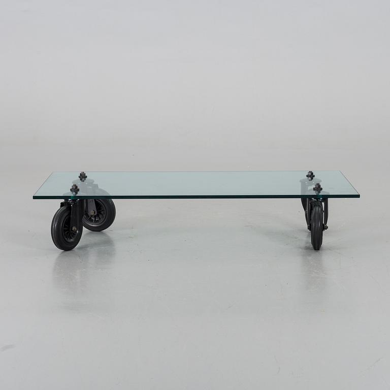 A COFFEE TABLE "Tavolo con Ruote", by Gae Aulenti, Fontana Arte, Italy.