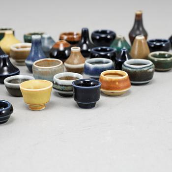 RÖRSTRAND, a set of 52 stoneware mini miniature vases and bowls.