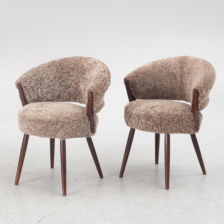 A pair of armchairs, AB Bröderna Biörs Snickerifabrik, mid-20th century.