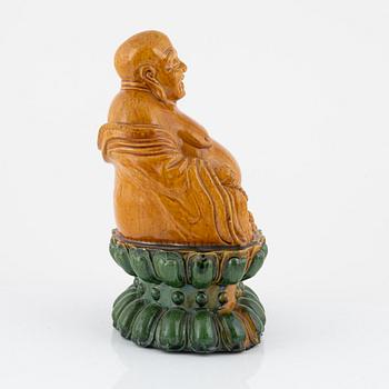 A ceramic Budai, China, 20th century.