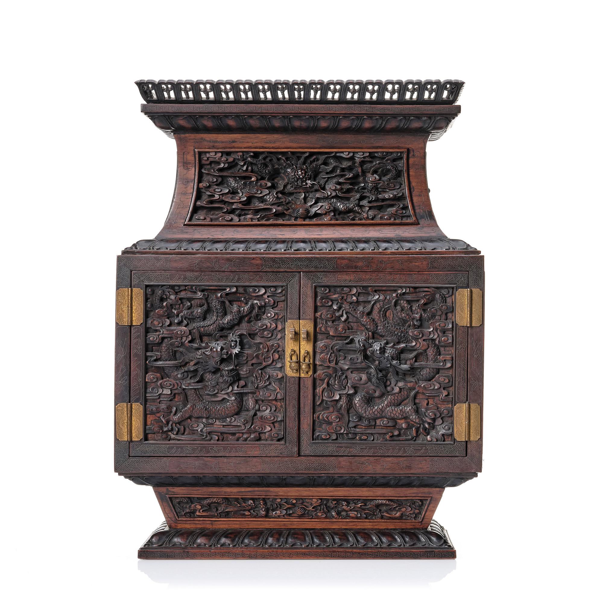 A hardwood dragon cabinet, Qing dynasty 18/19th Century.