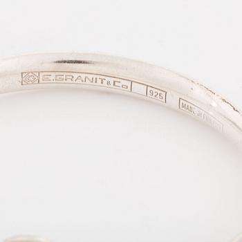 A silver Erik Granit bracelet.