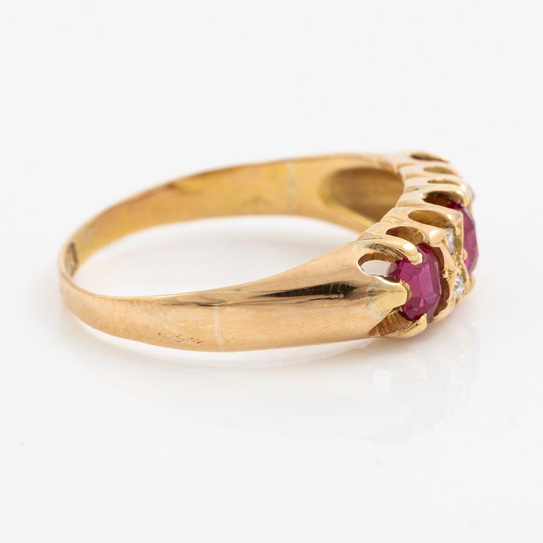 A ring 18K gold with rose-cut diamonds and red stones.