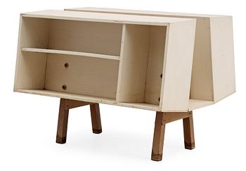 An Ernest Race white lacquered plywood and teak 'Penguin Donkey Mark II', bookcase, Isokon, England probably 1960's.